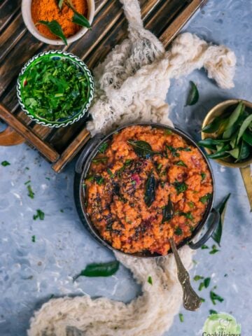 Instant Pot Beetroot Rasam Rice in a bowl with a bowl of dried cilantro on the side