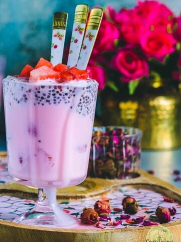 Mohabbat ka Sharbat served in a glass with 3 spoons in it.